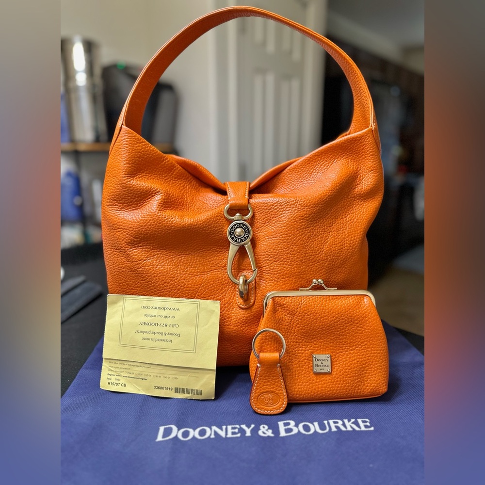 Dooney & Bourke Large Pebble Leather Logo Lock Hobo orange shoulder bag